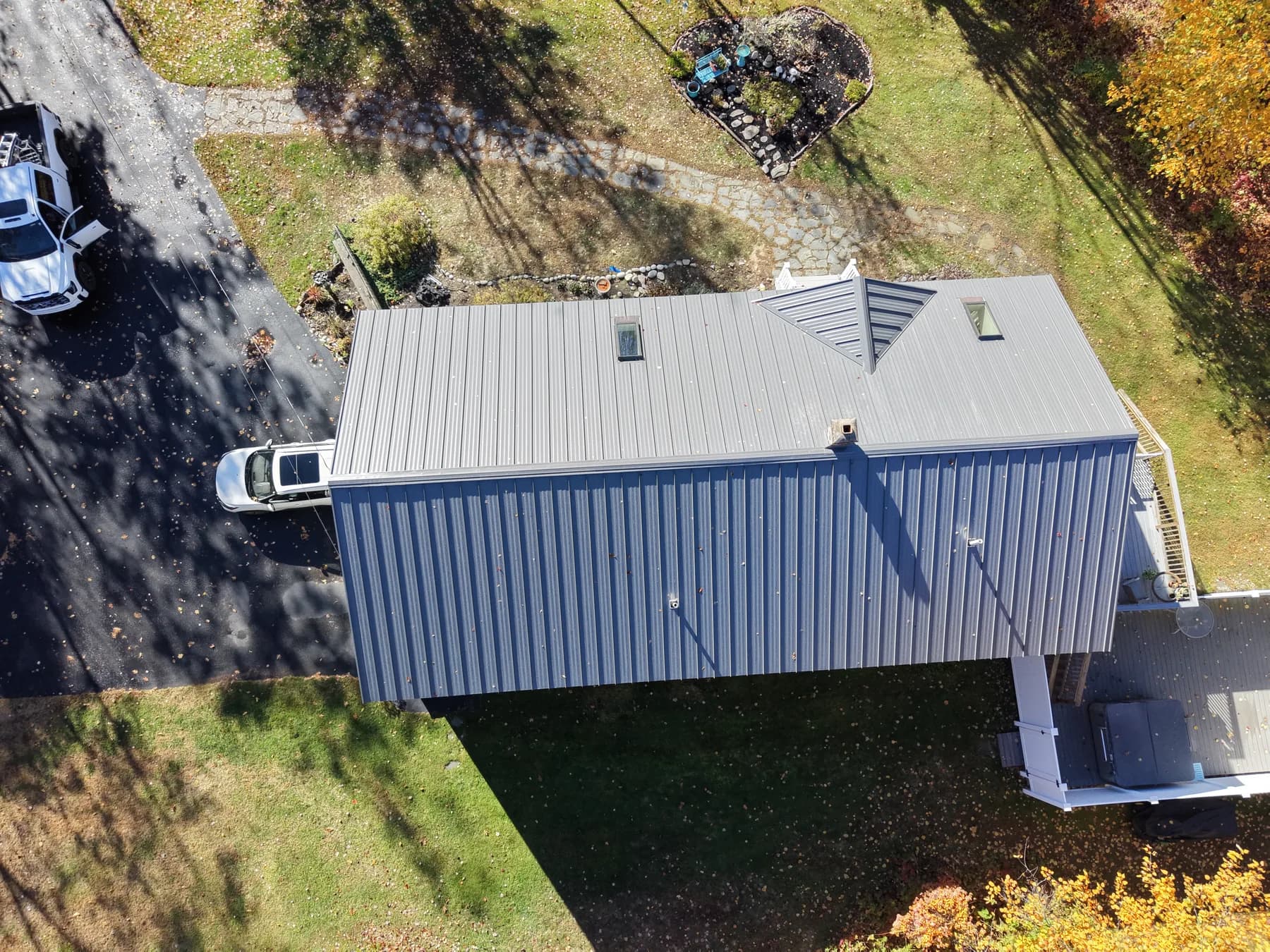 Completed standing seam metal roof project photographed from above in Southern Maine