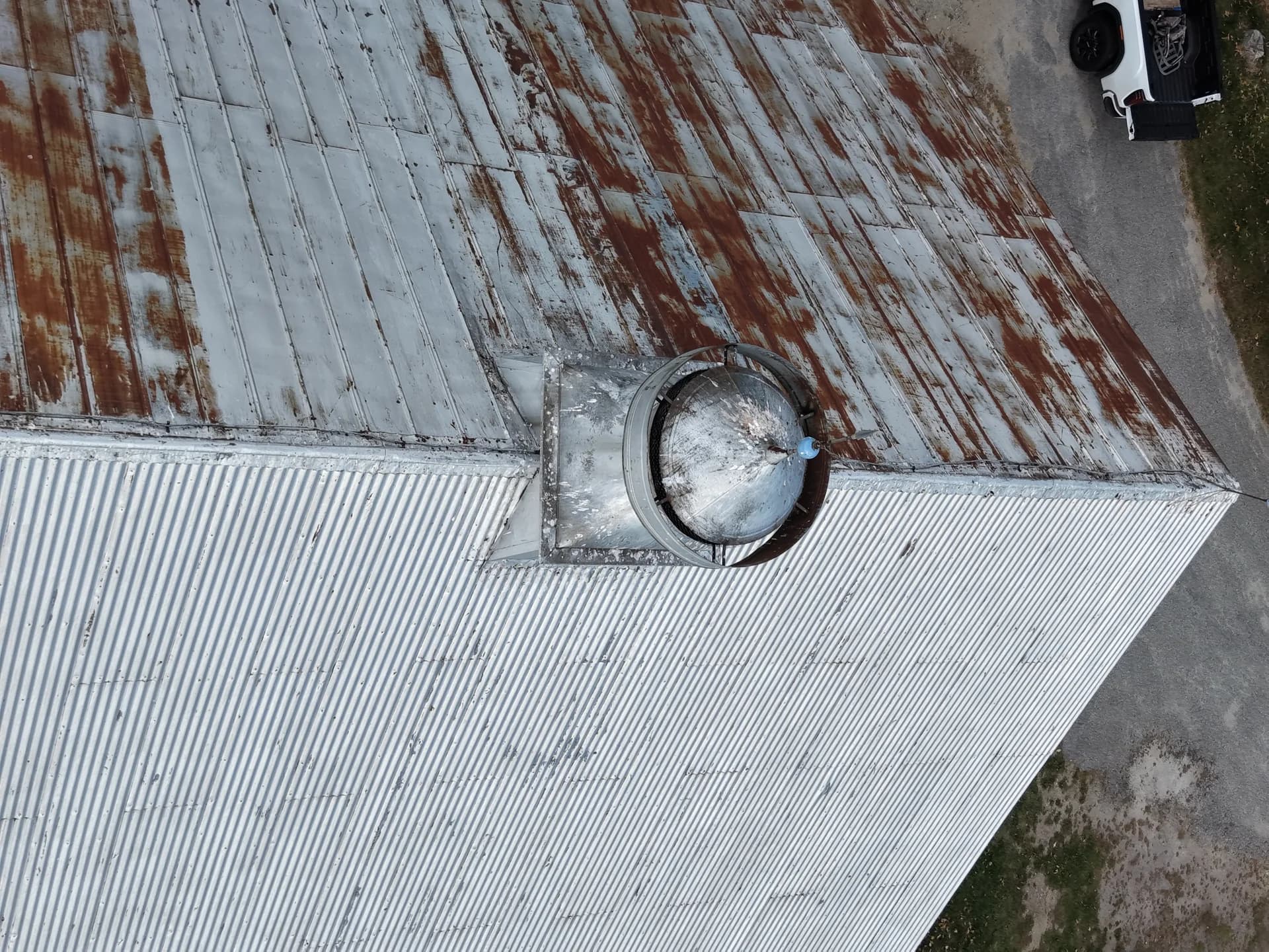 Old rusty metal roof before replacement - roof inspection showing need for new standing seam installation