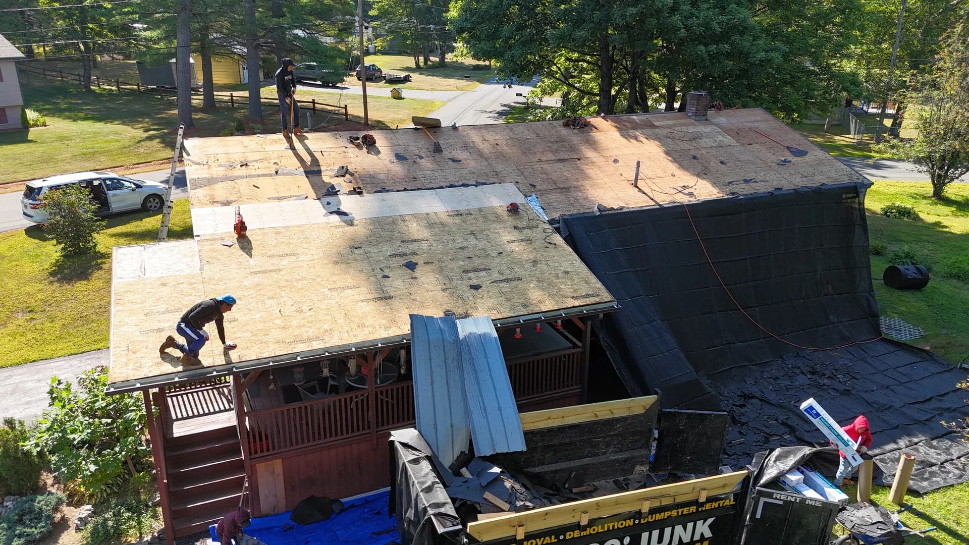 GraniteShield roofing crew installing new shingle roof - professional roofers at work in Southern Maine