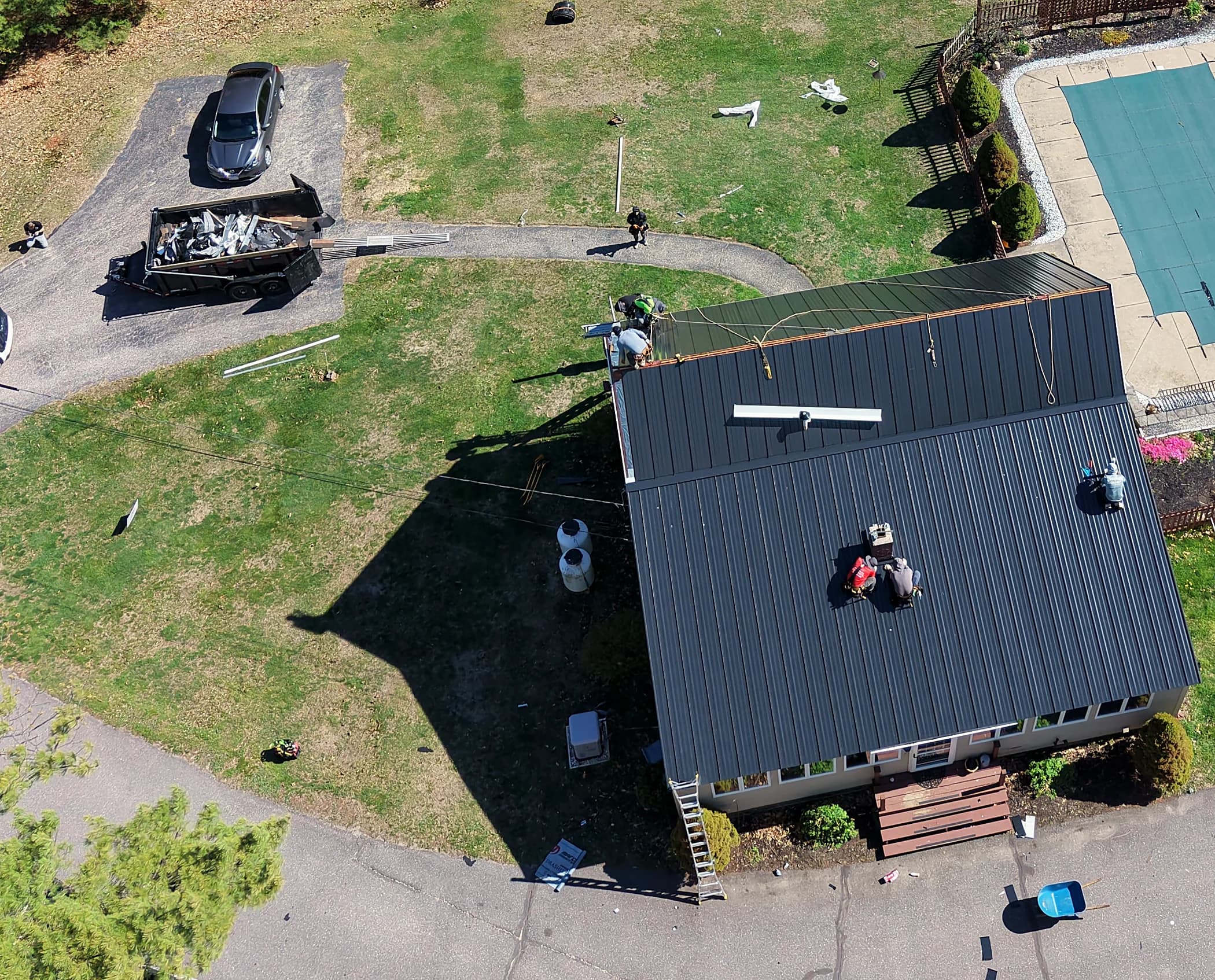 Roof tear-off and replacement in progress on a home in Gorham, Maine by GraniteShield Roofing & Exteriors